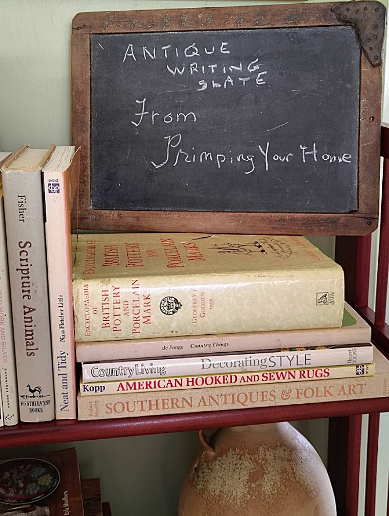 Antique Blackboard `Pine Framed Writing Slate sitting on books