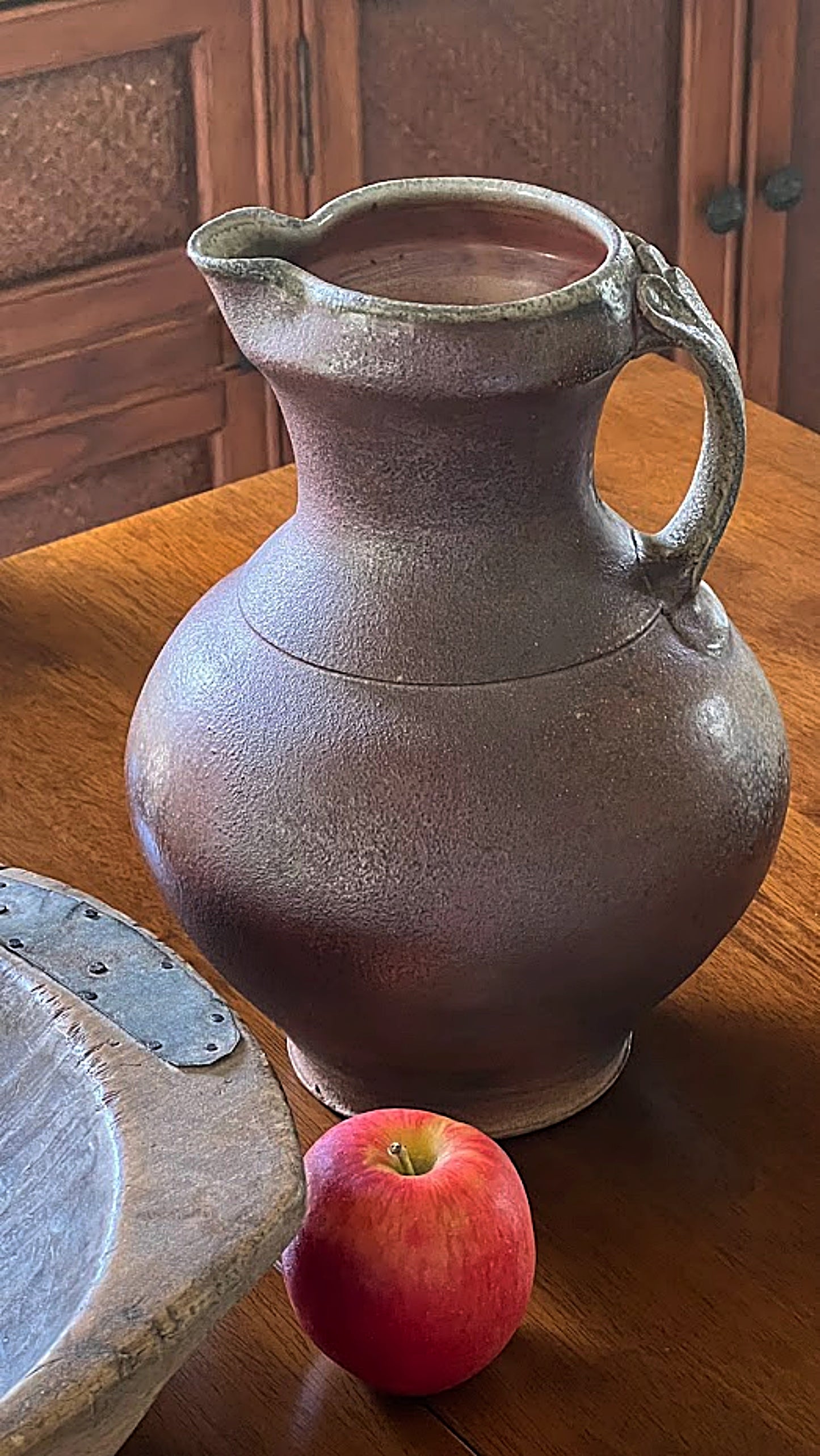 Vintage Studio Pottery Pitcher Salt and Ash Glazes Artist Monogrammed next to apple