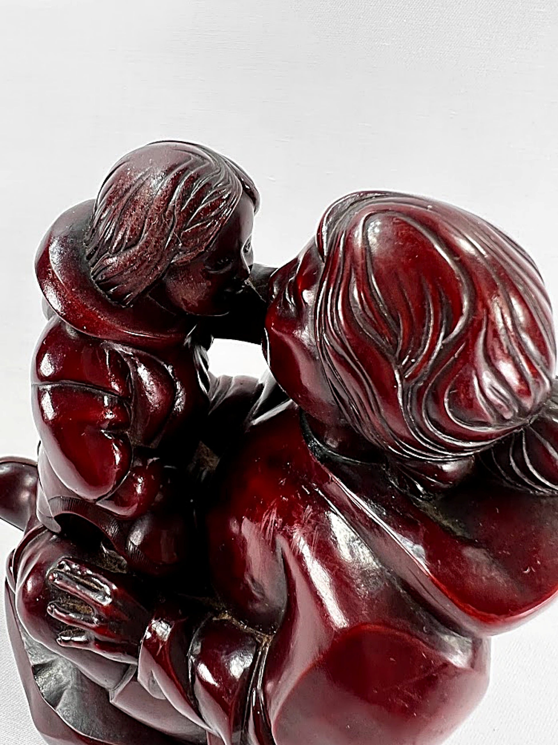 Inuit Mother and Child Sculpture by Thomas McPhee face to face
