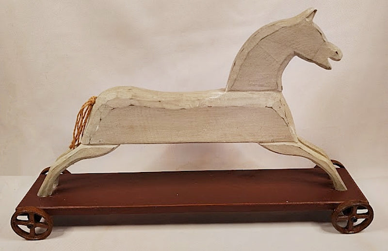 Folk Art Wood Horse Carved and Painted on Iron Wheels Full view right