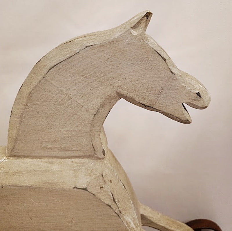 Folk Art Wood Horse Carved and Painted on Iron Wheels Head Closeup