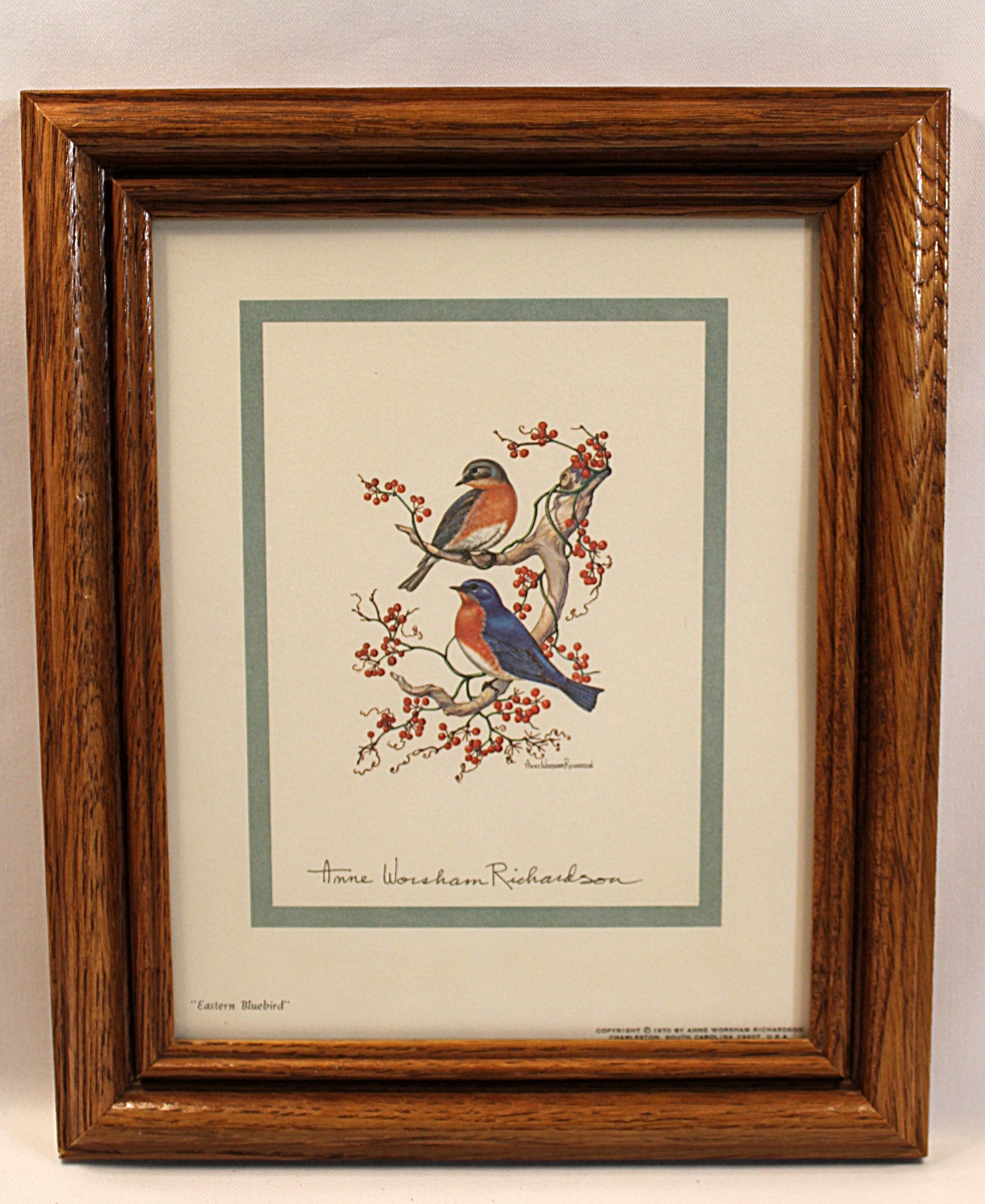 Framed artwork of birds on branches with berries by Anne Worsham Richardson Bluebirds Print