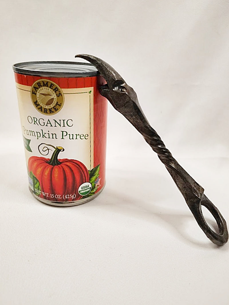 Folk Art Crow's Head Bottle and Can Opener Church Key leaning on can