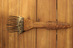 AfricanCarvedWoodenFiberCombwithForgedIronSpikes-Up-Facing-Front-left-table