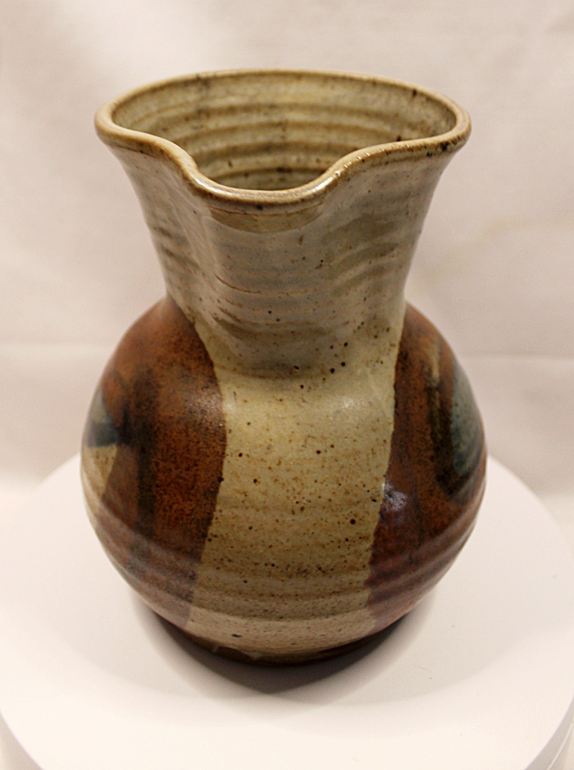 Stonewear pitcher by Bill Heyduck showing spout front view