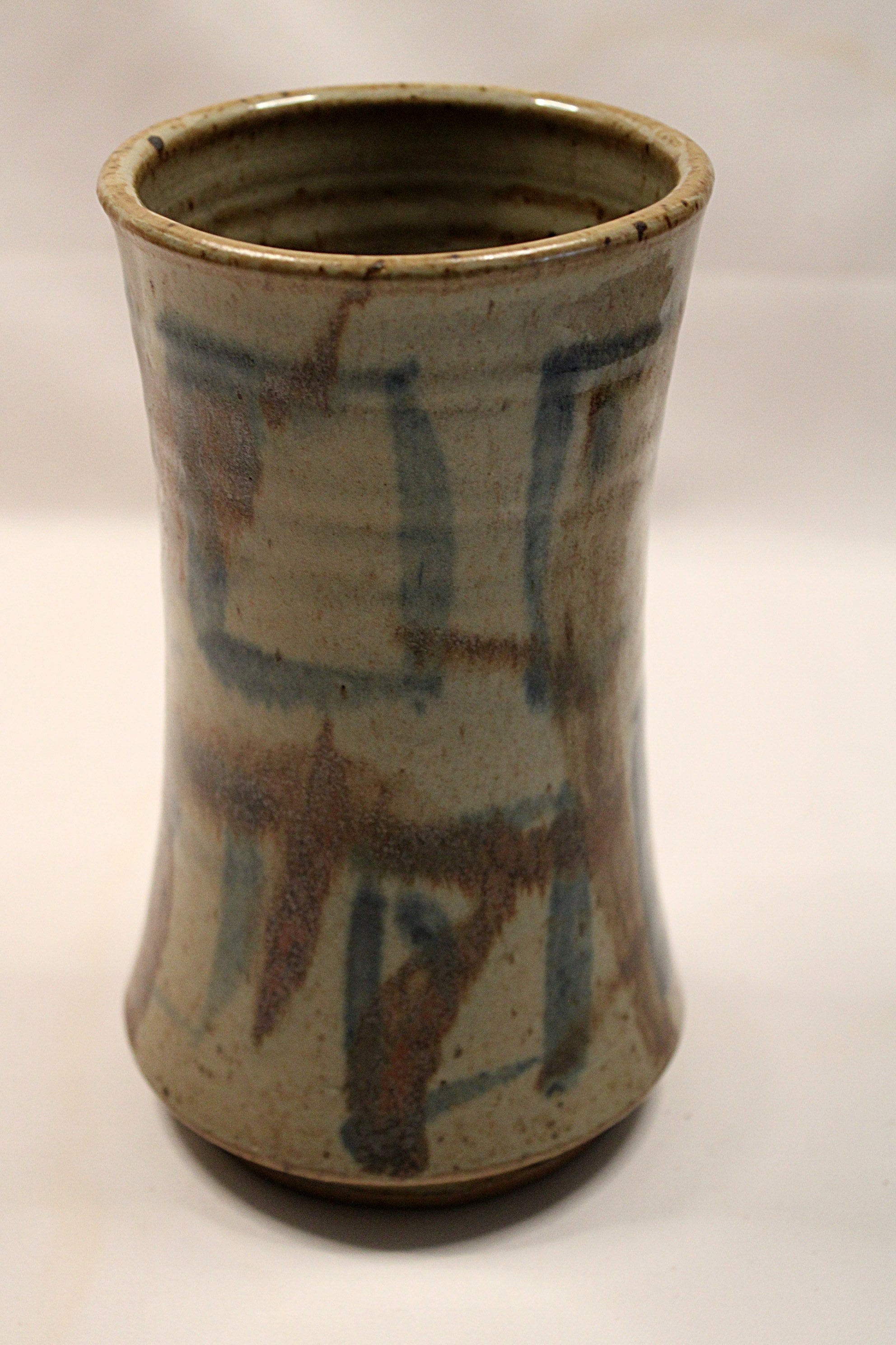 Ceramic vase with abstract patterns on a white background created in 1993 by Bill Heyduck