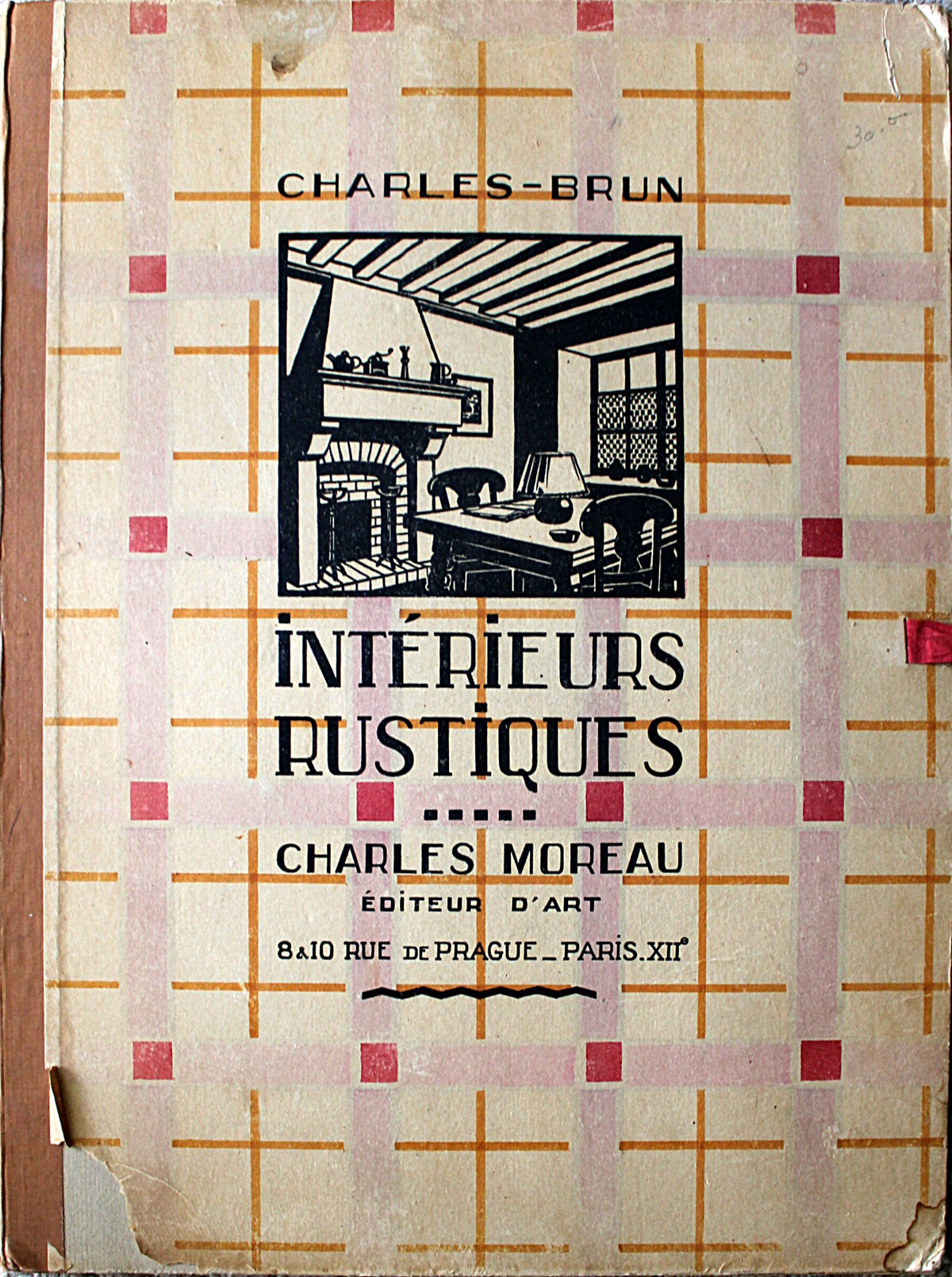 Vintage book cover for 'Intérieurs Rustiques' by Charles-Brun and Charles Moreau, featuring a beige background with a pink and orange grid pattern and a central black illustration of a rustic room.
