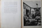 Antique French Folio Book Titled Interieurs Rustiques Paris 1926
showing a two-page spread. The left page contains printed text, and the right page features a black-and-white photograph of an ornate interior room with a fireplace, table, and hanging lamp.