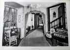 Antique French Folio Book Titled Interieurs Rustiques Paris 1926
A black and white vintage photograph print depicting an elegant interior hallway with an arched doorway, patterned curtains, a chandelier, a piano, and a staircase.