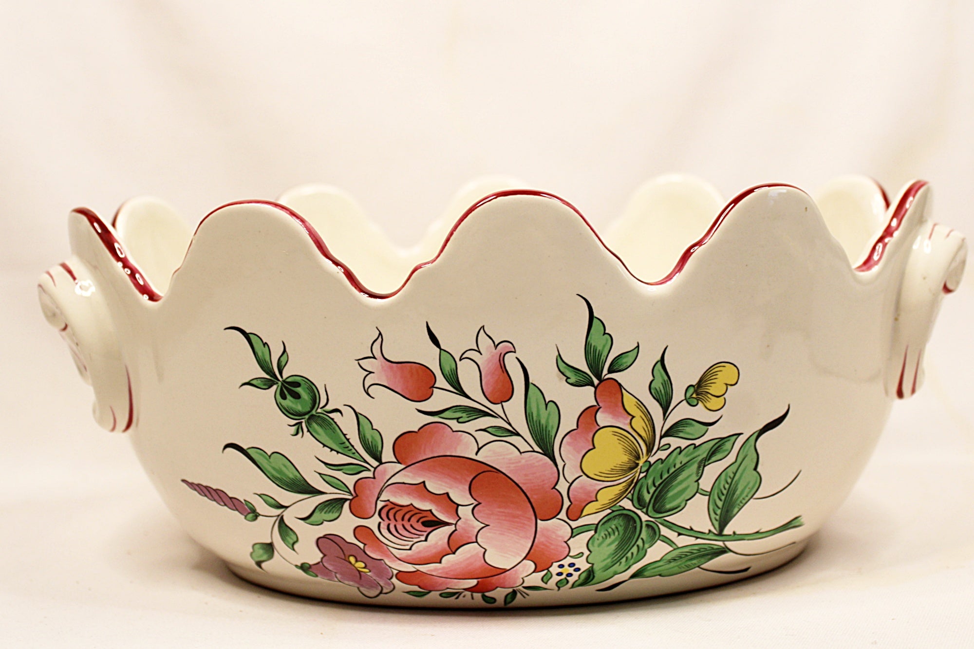 Decorative ceramic bowl with floral patterns on a white background