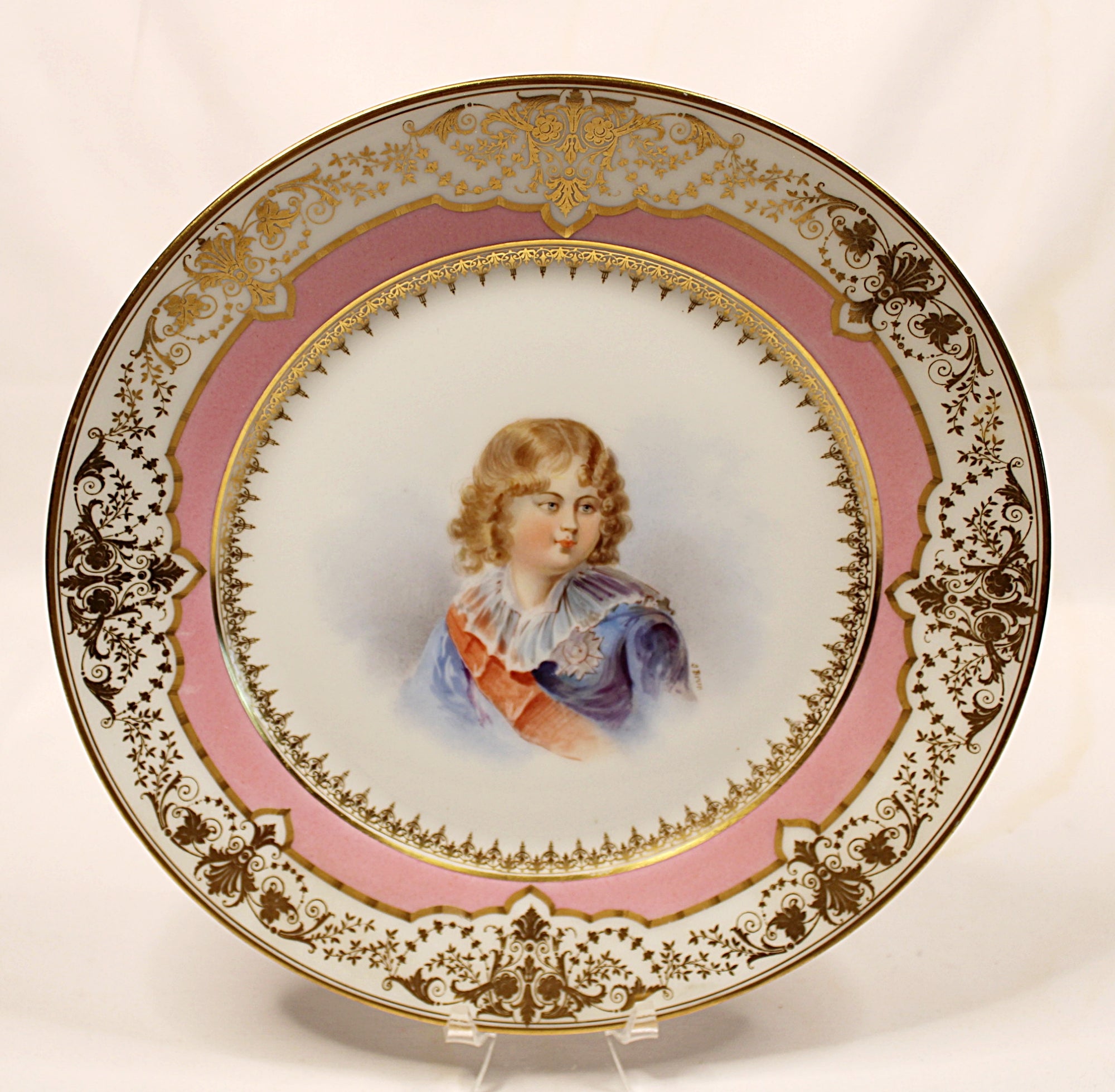 Decorative plate with a portrait of a young boy Napoleonll on a white background
