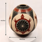 A decorative ceramic vase with a hand-painted geometric and animal-inspired pattern, shown with dimension arrows and text indicating a height of 6.75 inches and width of 6.