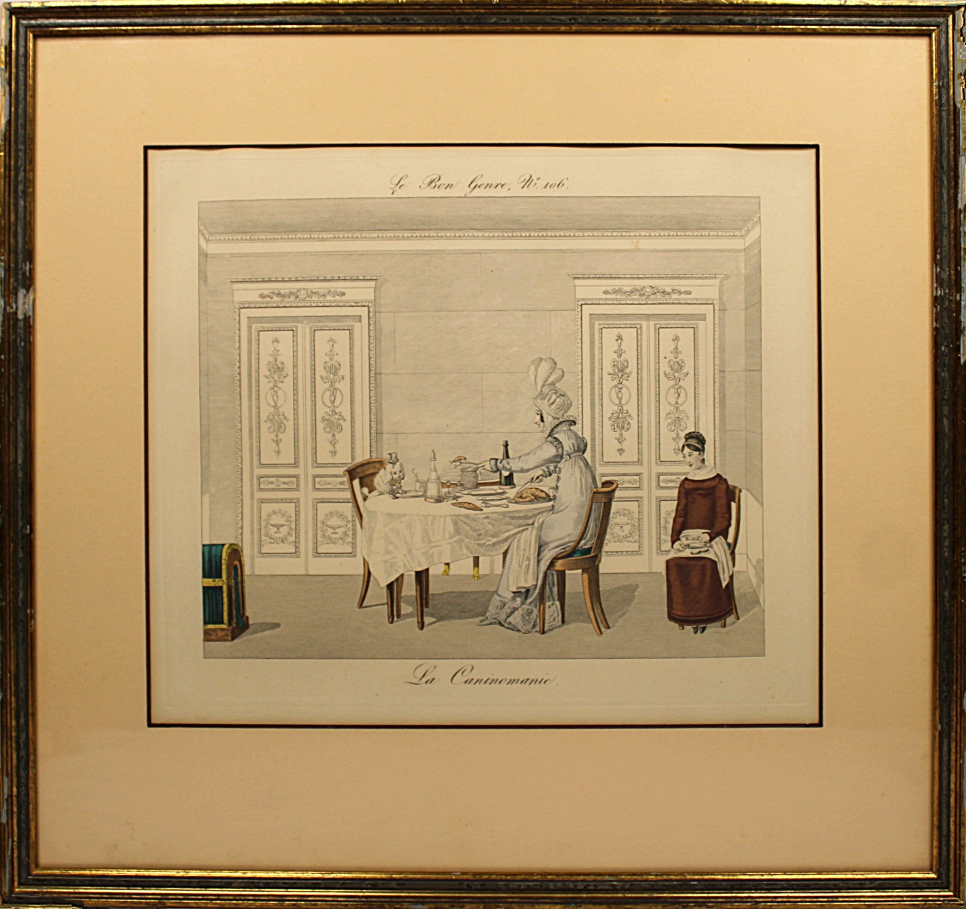Framed artwork of a classical scene with people at a table, likely from a historical or artistic period.