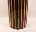 Bottom Half View Cylindrical ceramic vase with vertical striped pattern on a plain background