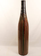 Decorative vase with striped pattern on a white background