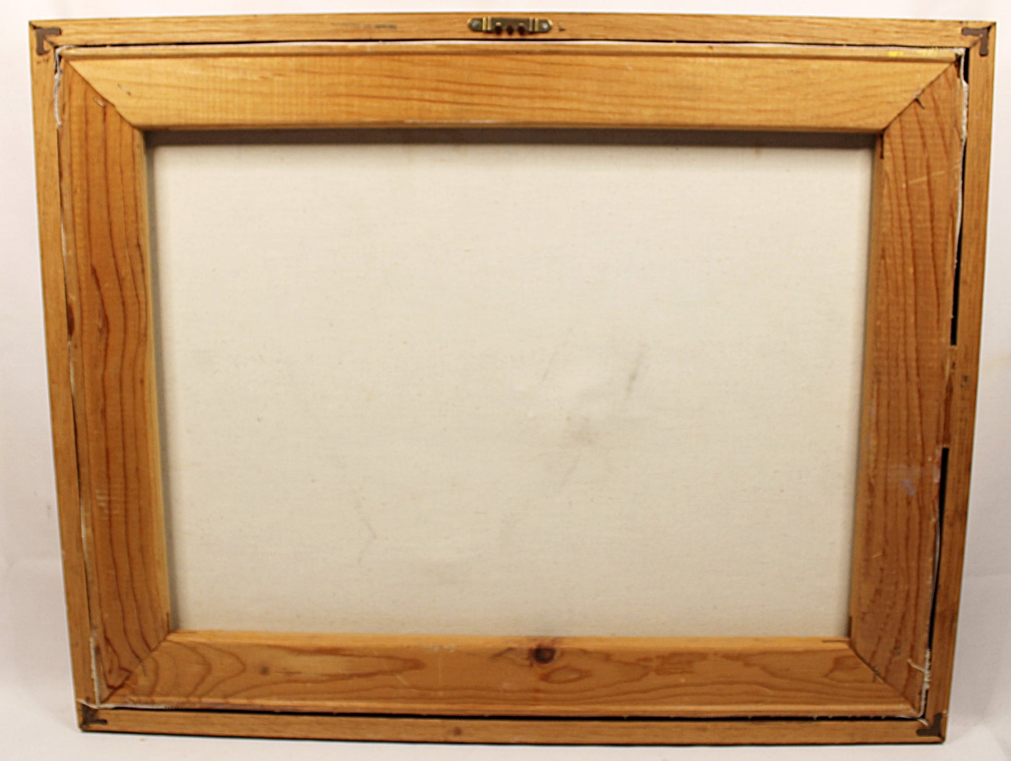 A wooden picture frame with a light brown pine finish and a blank off-white canvas insert, shown against a plain white background.