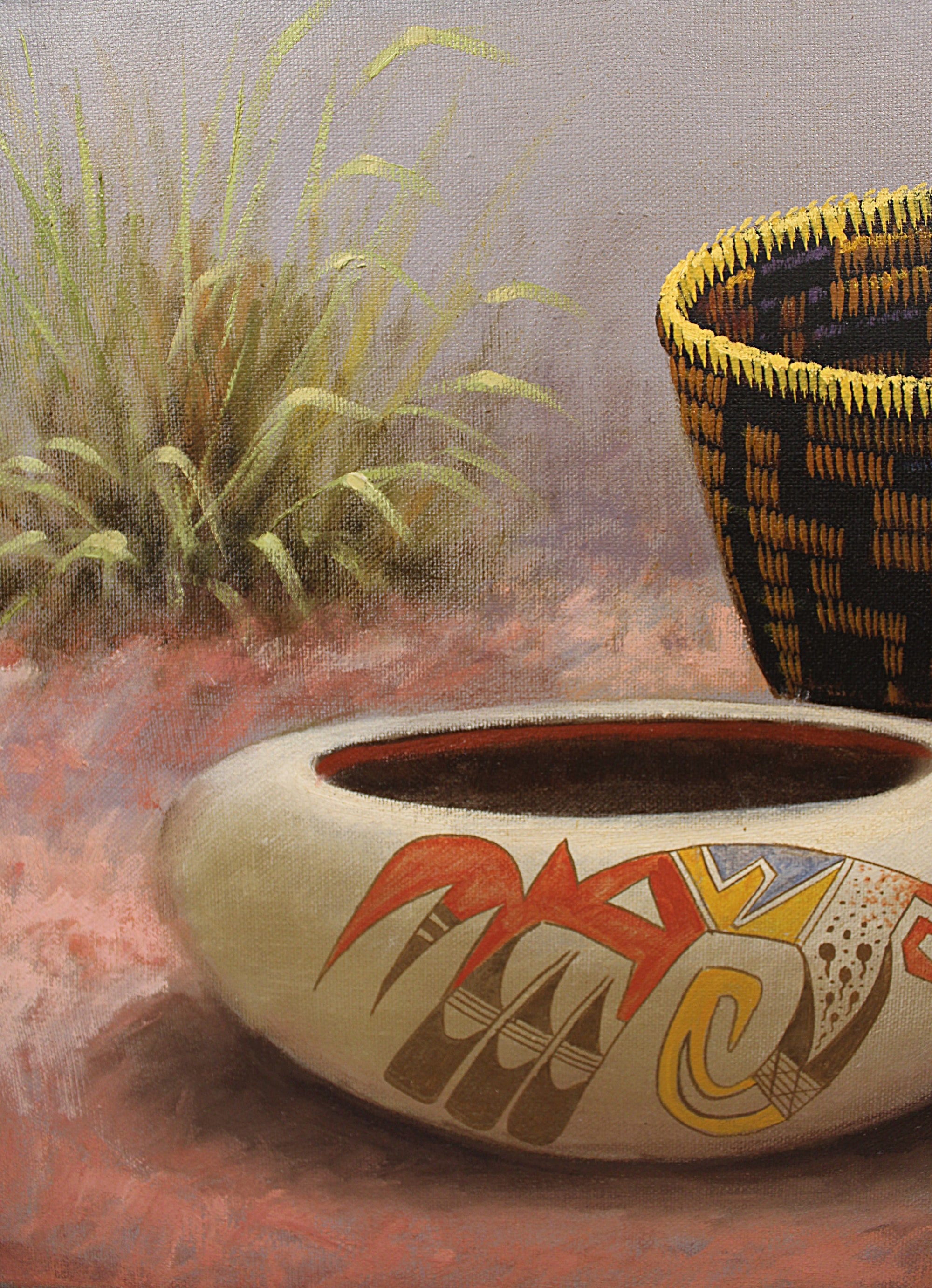 A painted still life showing a cream-colored bowl with red, yellow, and brown abstract patterns in the foreground, a woven basket in dark blue and yellow on the right, and green grass against a soft gray background.