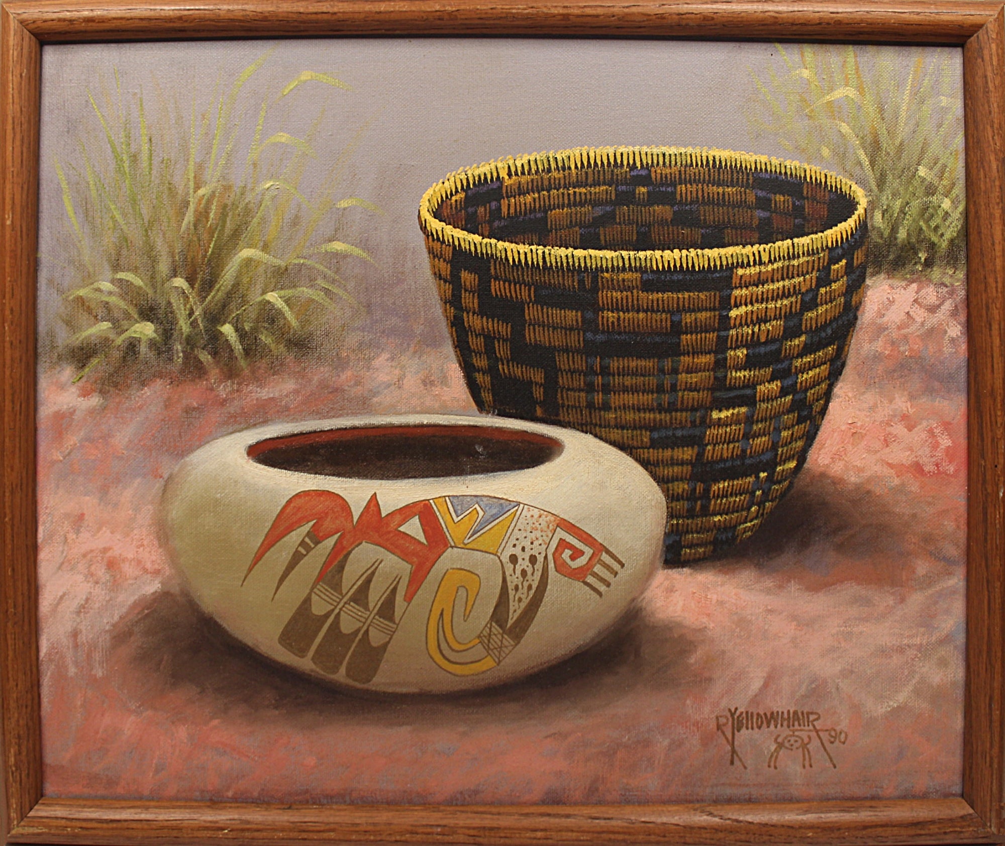 A framed painting depicting Southwestern-style woven baskets,  with geometric and animal motifs in red, yellow, and blue pottery bowl, and the other standing behind it. The scene is set against a dusty red ground with sparse grasses under a muted sky, all enclosed in a brown wooden frame.