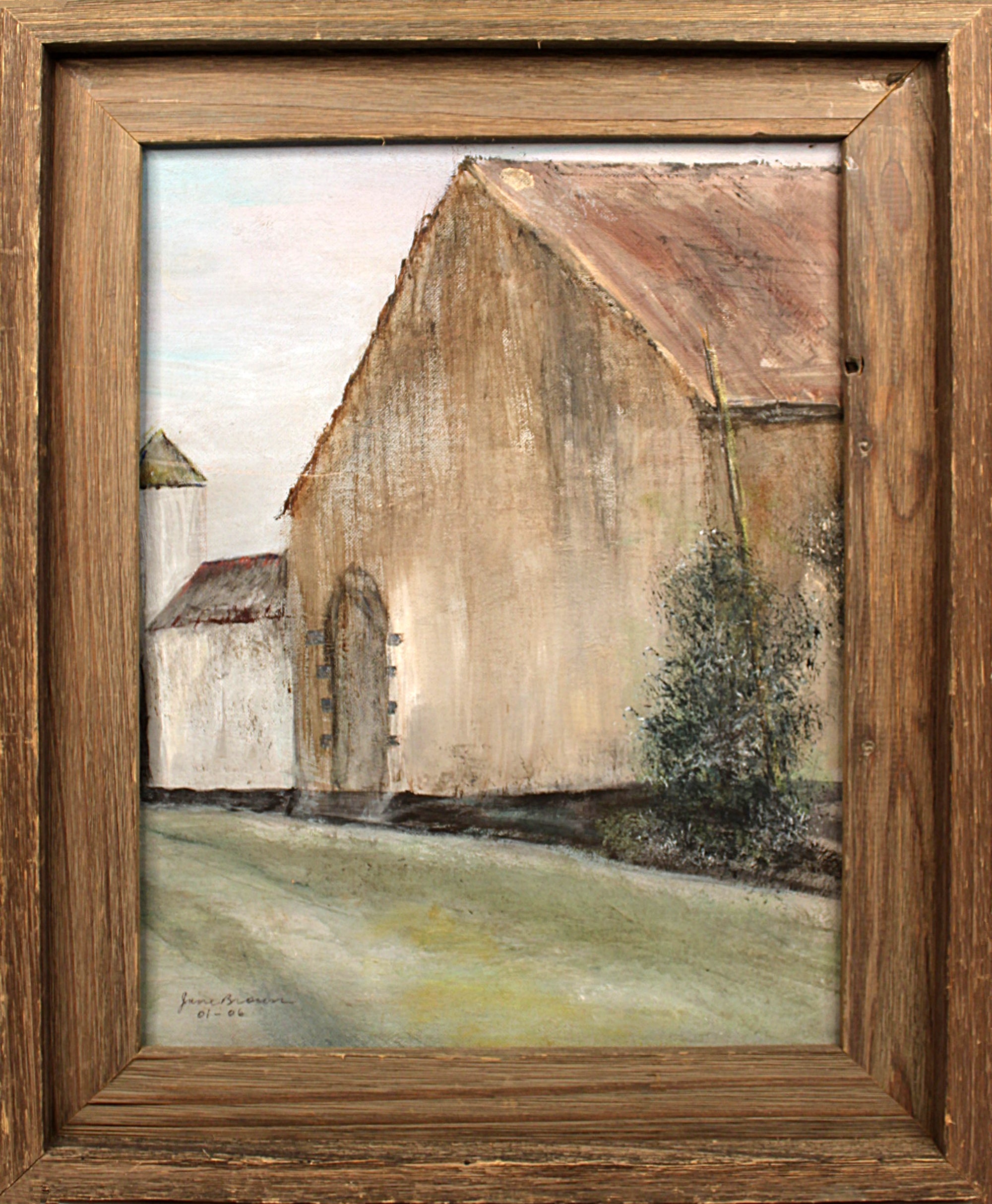 Painting of a rural landscape with buildings and trees, framed in wood.
