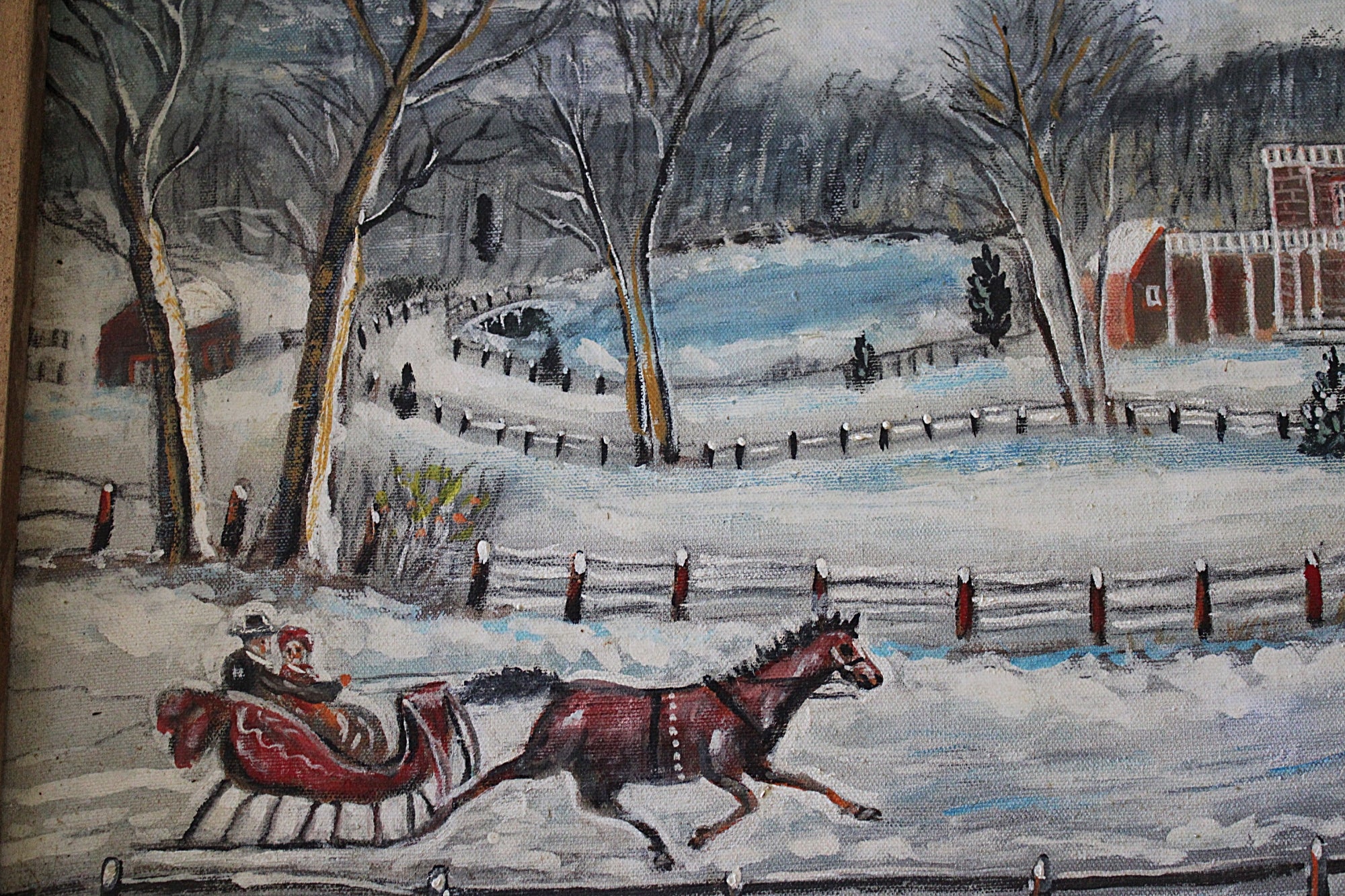 A winter landscape painting showing a horse-drawn sleigh with a person in the snow, bare trees, fences, and red buildings in the background.