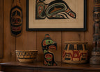 First Nations Thunderbird Wall Plaque Alert Bay BC by Tom Whonnock on dresser with other NW Art