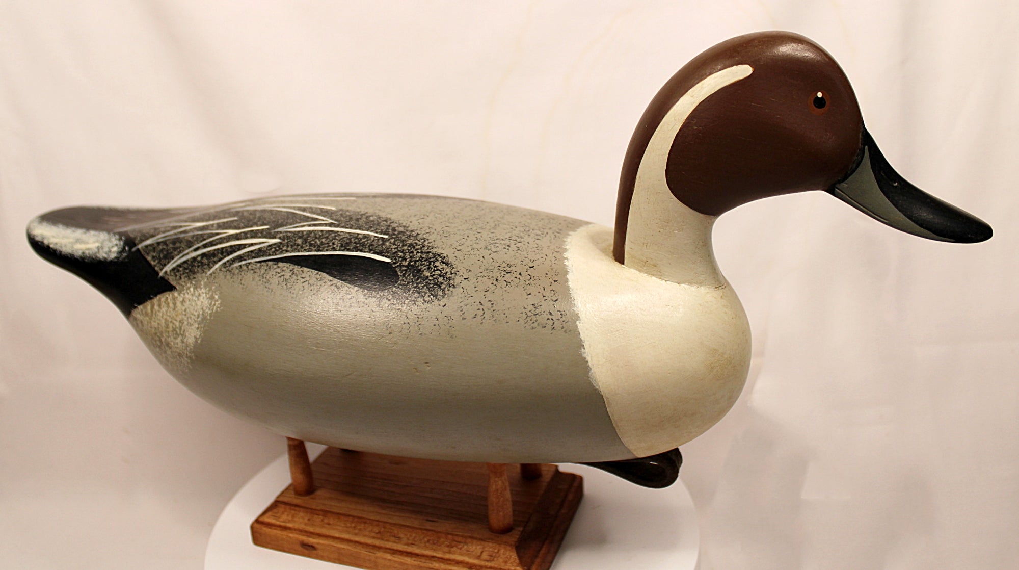 Duck decoy on a stand with a plain background Pintail Drake Duck Decoy Jim Burtis Maryland 1994