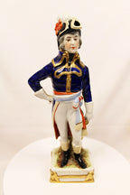 Porcelain figurine of a military officer in uniform on a white background